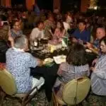 group shot of people eatig dinner at the AFE dinner in Maui