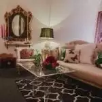 A vibrant showroom with ornate details and comfortable seating facilitates successful bridal consultations for Amanda Allen, of MMD Events in Tampa, Florida.