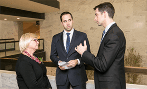 Jo Buttram, AAF, AMF, PCF, of Shirley’s Flowers & Gifts (shown with aides of Sen. Tom Cotton).