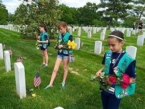 girl scouts laying flowers at National Memorial cemetary