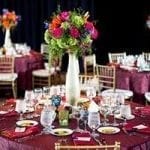 stock image of a event table decorated with place settings and flowers