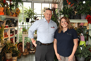 Joe Arthur, executive director, Central Pennsylvania Food Bank, and Erica Bixby, manager of Royer’s Flowers & Gifts in Hershey, which collected the most pounds of any Royer's store.