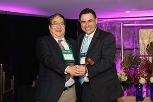 Former President Rob Shibata, AAF, President of Mt. Eden Floral Company LLC passed the gavel to President Santiago Cock-Rada, General Manager of Liberty Blooms. Santiago is the first Colombian president of WF&FSA. Photo courtesy WF&FSA