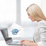 Woman at computer sending email