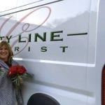 Sue from City Line Florist in front of her new delivery van