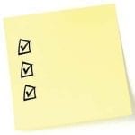 stock image of a post it now with check marks