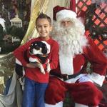 In exchange for an email address, Stacey Cofka, owner of A Blossom Shop Florist in Bayville, New Jersey, offered guests a cute photo of their kid (four-legged ones included) with Santa.