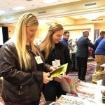 Profit Blast participants Lacey Schoenbeck and Daisy West check out the Supplier Expo. The two were among 121 floral industry members to attend the event last weekend in Omaha.