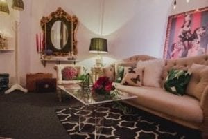 A vibrant showroom with ornate details and comfortable seating facilitates successful bridal consultations for Amanda Allen, of MMD Events in Tampa, Florida.