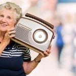 old lady holding a radio