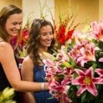 two ladies looking at flowers at SAF annual OV competition