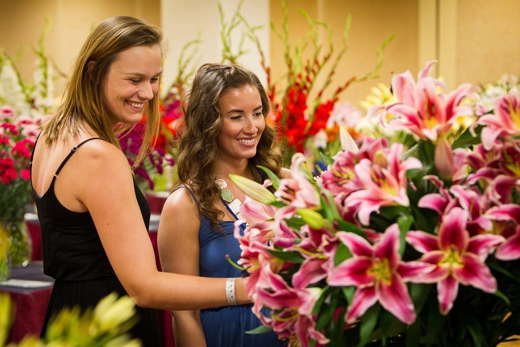 two ladies looking at flowers at SAF annual OV competition