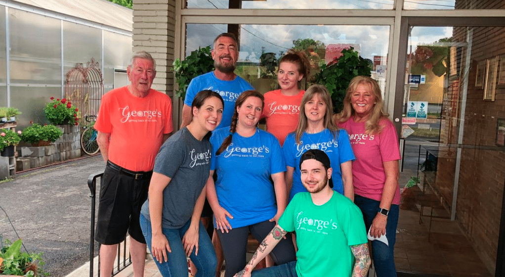 Super soft t-shirts with a catchy shop slogan have become bright, happy staff uniforms and “walking billboards” for George’s Flowers in Roanoke, Virginia.