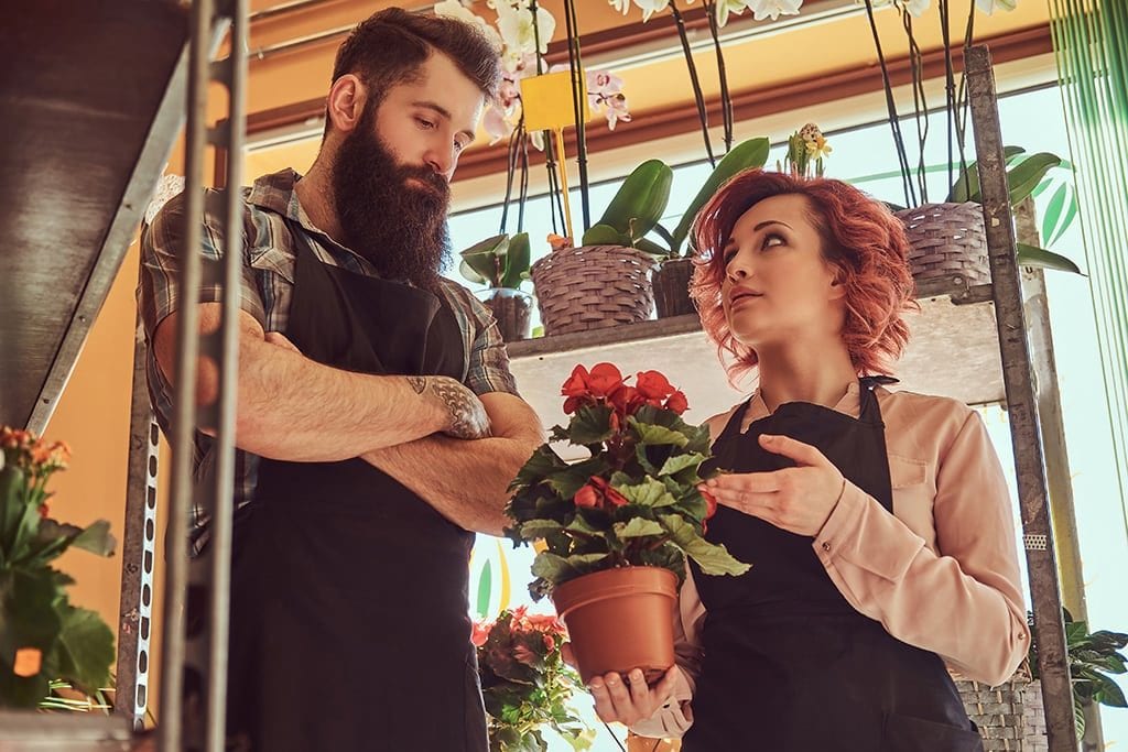 family members in a florist looking annoyed with each other