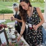 Holly Haveman of Kennedy’s Flower shop in Grand Rapids, Michigan, and Lynne Tischler, AAF, CPFD, PFCI of Your Enchanted Florist in St. Paul, Minnesota prep their flowers at the boutonniere bar before the Field to Vase dinner at SAF Palm Springs 2018