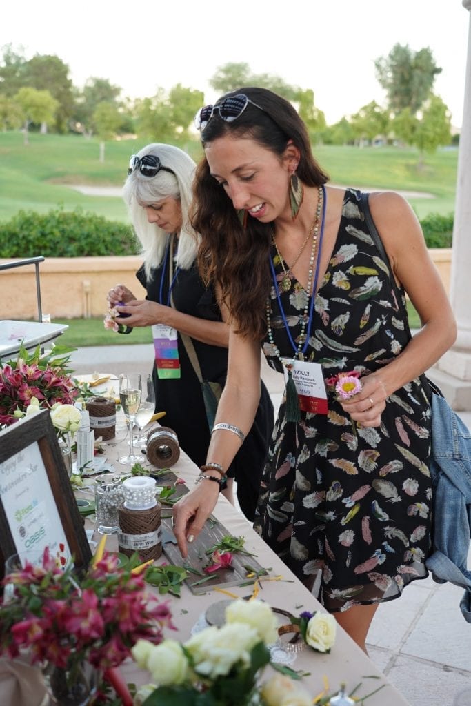 Holly Haveman of Kennedy’s Flower shop in Grand Rapids, Michigan, and Lynne Tischler, AAF, CPFD, PFCI of Your Enchanted Florist in St. Paul, Minnesota prep their flowers at the boutonniere bar before the Field to Vase dinner at SAF Palm Springs 2018