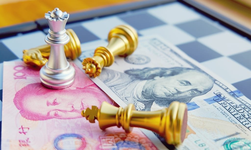 Money game. Chess game. Referring two big countries's conflict. Trade war. Chinese and US bank note under Silver Queen that stands as a winner. International finance concept.