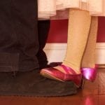 daughter dancing on father's feet