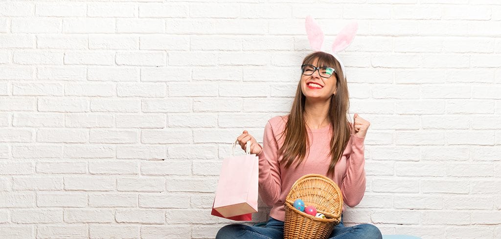 Easter holiday with a women sitting on the floor holding a lot of shopping bags